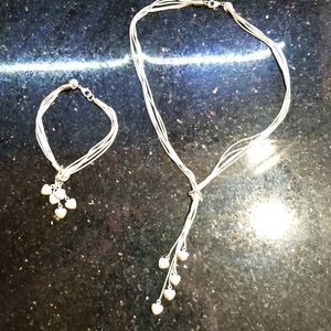 Sterling Silver necklace and bracelet with dangling hearts
